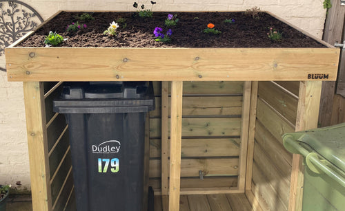 Double wheelie bin store with green roof planter. Recycling wheelie bin storage / wooden wheelie bin storage