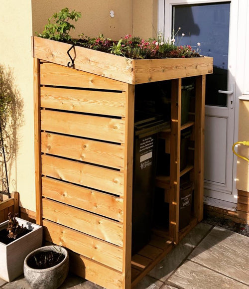 Wheelie bin store with recycling box shelves and living roof planting area. Wheelie bin and recycling bin storage. UK bin tidy. Wheelie bin cover