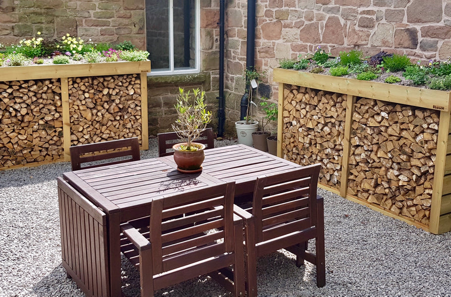 Large log stores with green roof planter for sedum 