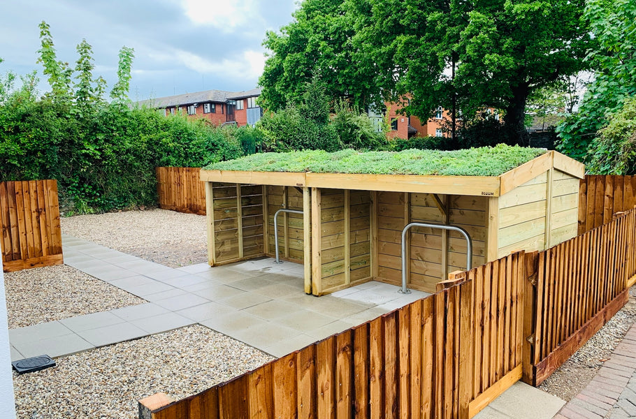 Green roof bike shelters with sedum planting area, for this sustainability award winning housing development 