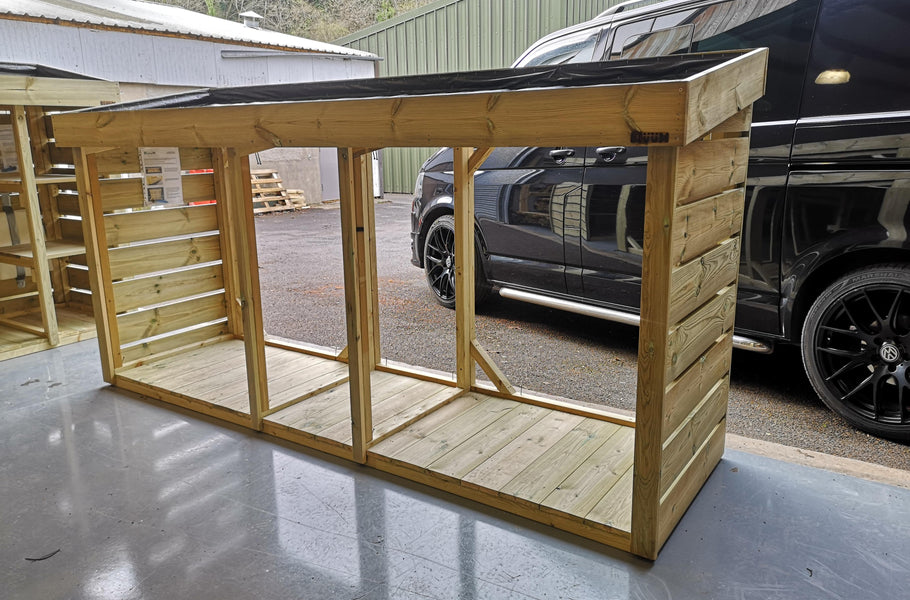 Five wheelie bin store with open back panel and green roof planter 