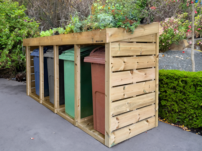 Four wheelie bin store, for quadruple wheelie bin storage. The green roof planter hides garden and household wheelie bins. Wooden wheelie bin storage UK 