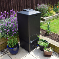 A HOTBIN Mini 100L hot compost bin in a back garden setting