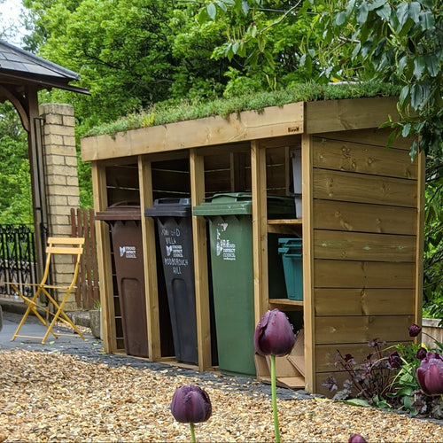 Triple Wheelie Bin & Recycling Store: 'Taller' version with a full wooden base and fully clad back panel.  Green roof planter top. 