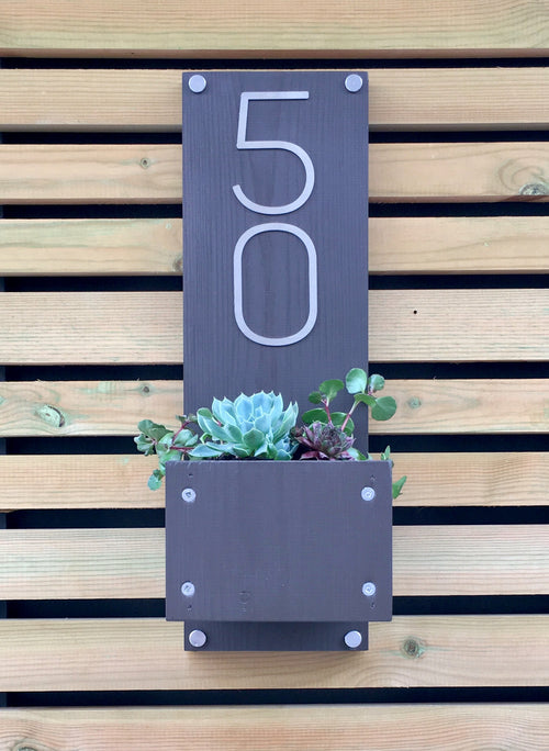 Modern home house number sign plaque with stainless steel numbers and timber planting area for succulents
