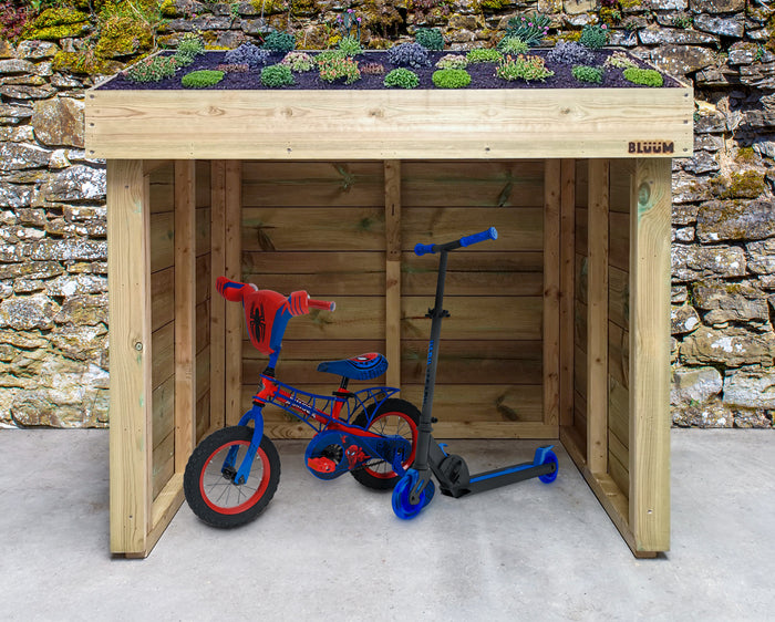 Childs / kids bike and scooter shelter, hand made from wood and with a living green roof planting area for plants such as sedum and wildflowers. Outdoor bike storage. Wooden children's bike shelter, scooter storage, small bike shed