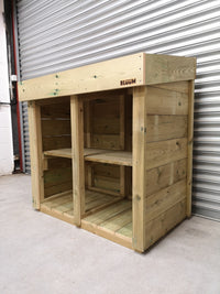 Hand made wooden storage unit for recycling boxes in gardens, with green roof system 