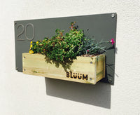 Curb appeal with a Bluum house sign, beautiful fixings, plants and your house number 